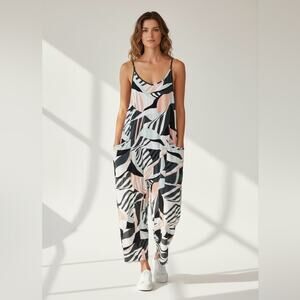 Free People Movement Hot Shot onesie Peached Ivory combo print size medium